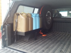 Jerry cans and spare tire frame.